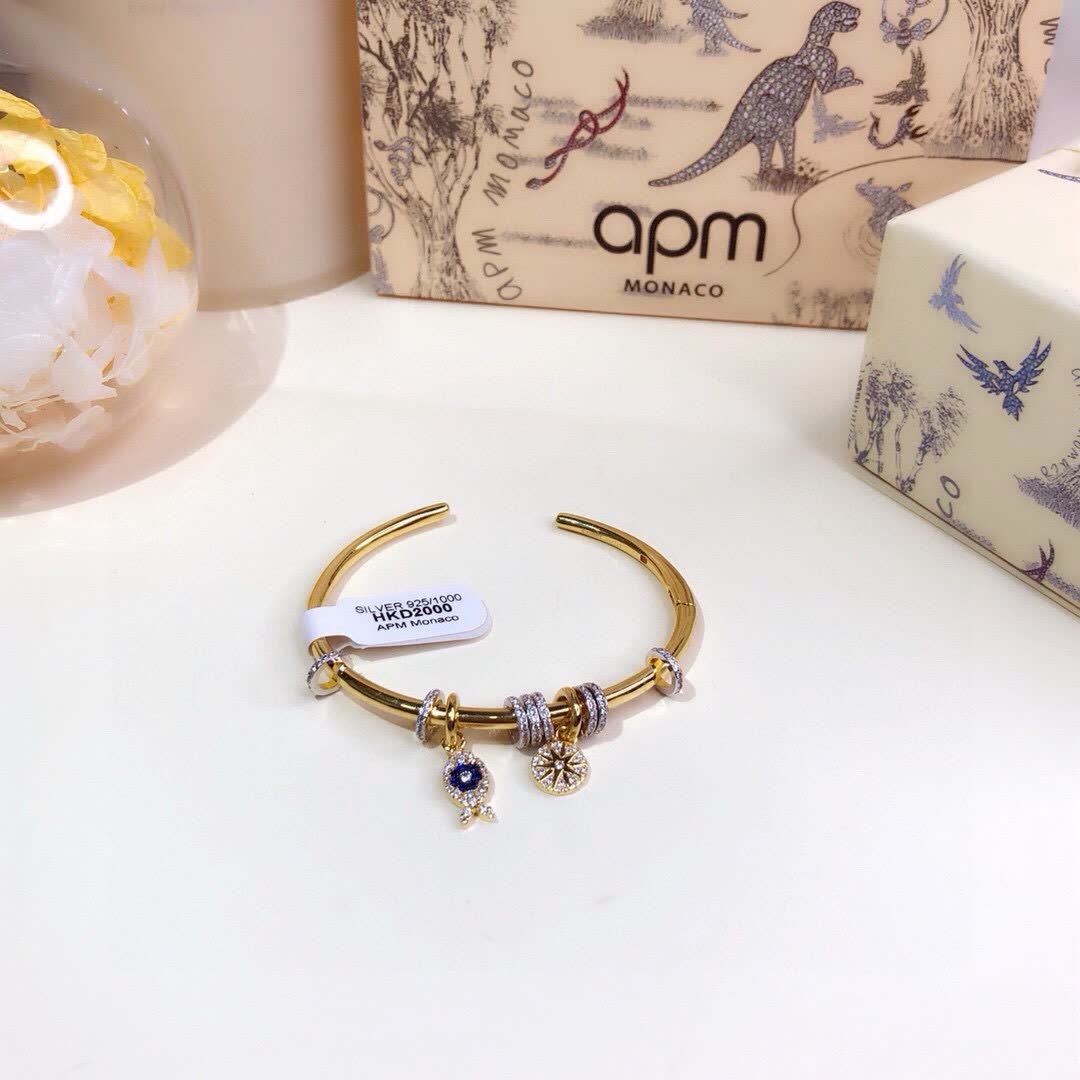 APM Monaco Gold Tone Bracelet with Fish and Star Charms